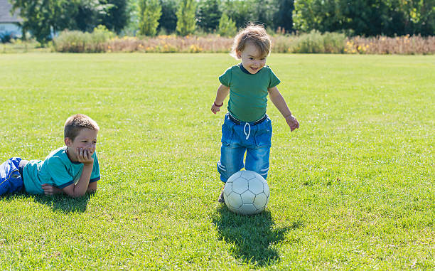 istock kid's on football field 184585258