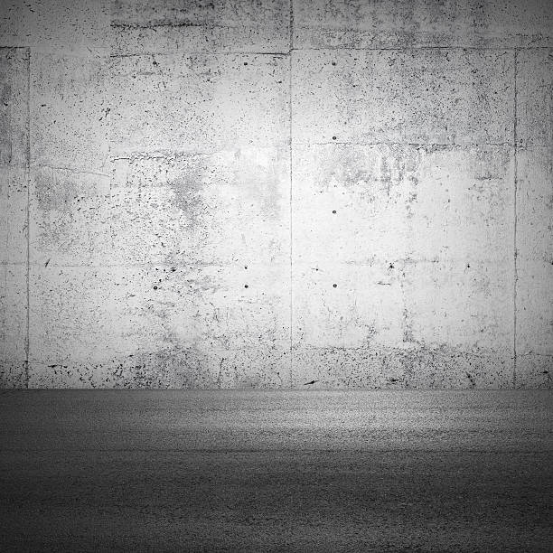 istock Abstract parking interior fragment with concrete wall and asphal 184585299
