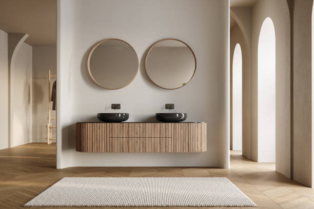 istock Modern bathroom interior with dark brown parquet floor, two sinks, double mirrors, white bathtub, interior plants, front view. Minimalist bathroom with modern furniture and arches. 1845867111