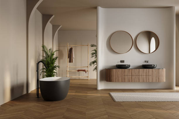 istock Modern bathroom interior with dark brown parquet floor, two sinks, double mirrors, white bathtub, interior plants, front view. Minimalist bathroom with modern furniture and arches. 1845868031