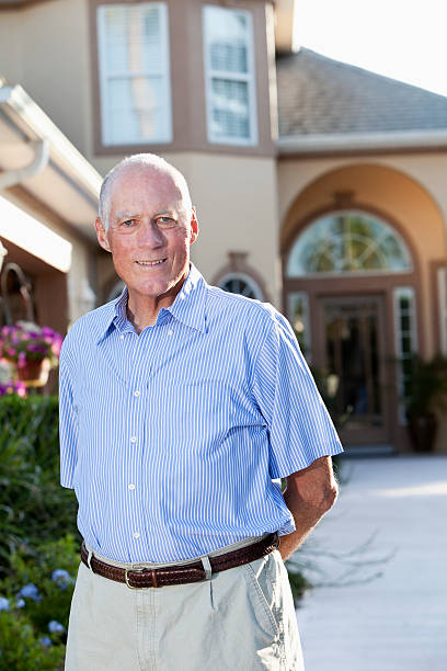 istock Senior man in front of home 184591402