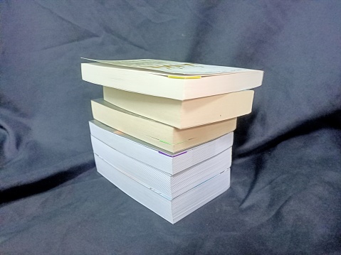 Stack of books on a black background. Back to school. Photo taken in malaysia