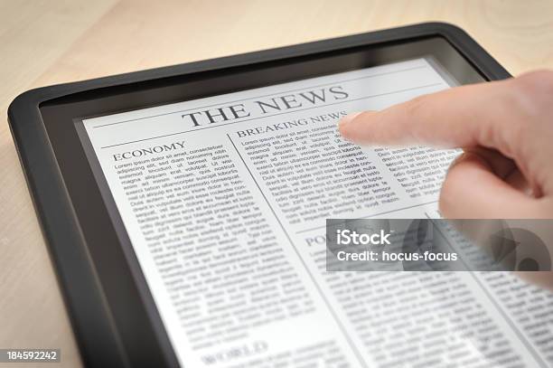 Reading News With Digital Tablet Stock Photo - Download Image Now - Digital Tablet, Newspaper, Adult