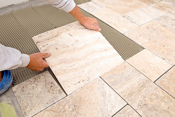 closeup of ceramic tile floor with reflection from window