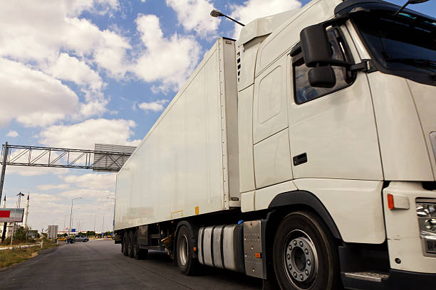 istock White truck on asphalt road 184592381