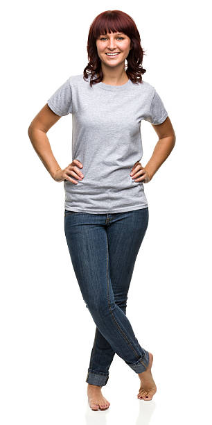 Smiling Young Woman Standing With Legs Crossed Female portrait on a white background. http://s3.amazonaws.com/drbimages/m/rh.jpg short sleeved stock pictures, royalty-free photos & images