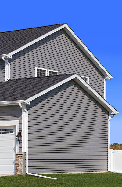 New house showing siding,gutter,fence and garage door stock photo
