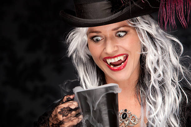 istock Halloween Witch Enjoying a Cup of Coffee 184593309