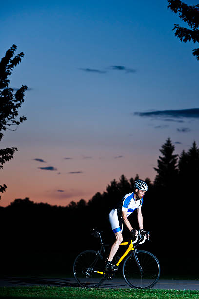 Cyclist at night stock photo