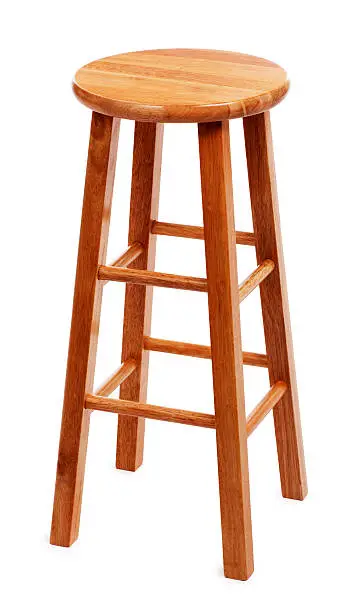 This is a photo of a tall wooden stool on a white background.