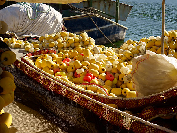 istock Closeup on fishing net with yellow floaters 184594796