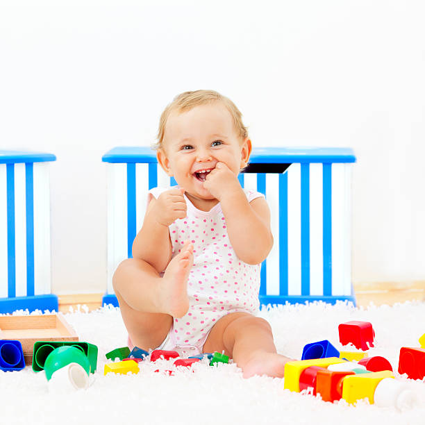 istock Baby girl having fun at home 184595182
