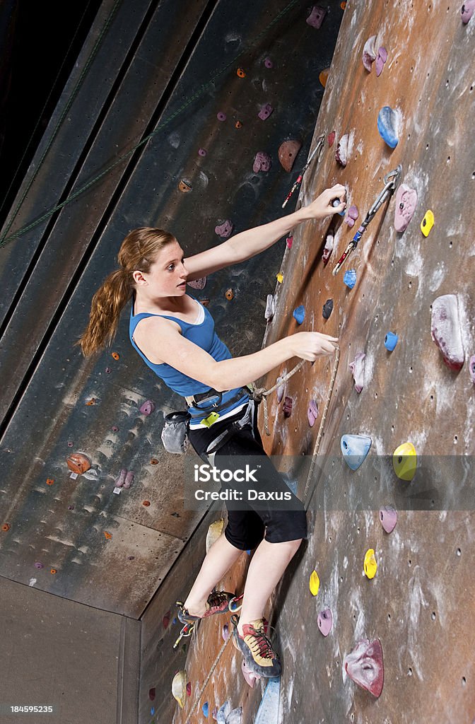 Teenage Girl Climbing Teenage Girl Climbing at a indoors Climbing Gym - Shot at Utahlypse 2011 Active Lifestyle Stock Photo