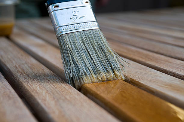 istock Painting Wood Stain on Patio Set 184595315
