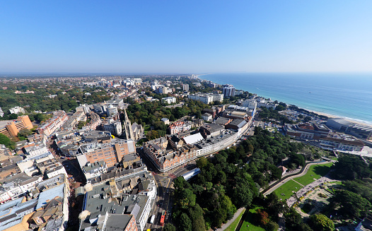 An aerial view over the popular tourist destination of Bournemouth, a seaside town in Dorset. Taken from 500 feet up in a balloon. Wide angle lense used. Logos removed and people too small/indistinguishable for model release.