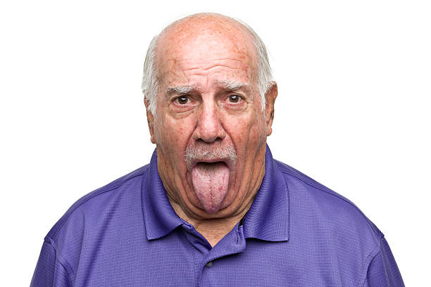istock Senior Man Sticking Out Tongue 184595597
