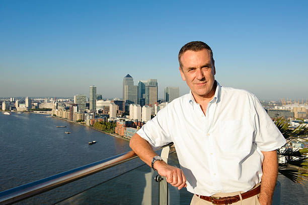 istock Senior Man on Balcony with London View 184595605