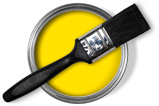 istock Open tin of yellow paint with paint brush on top 184595670