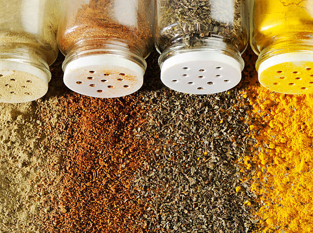 Spices and bottles Bottle of spices with spices background cajun food stock pictures, royalty-free photos & images