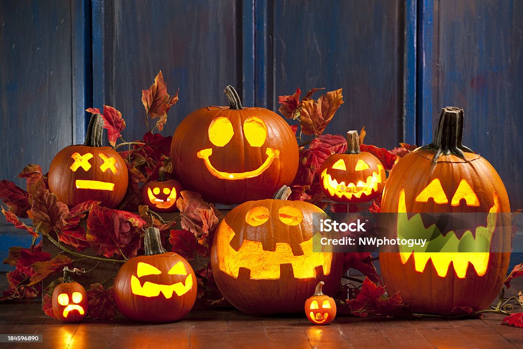 Halloween Jack-o-Lantern Pumpkins A group of Jack-o-lanterns lit up for the holiday.Click here To View My Halloween Lightbox Pumpkin Stock Photo