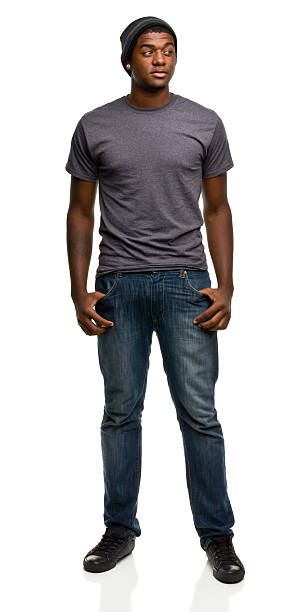 The portrait of a young black man, on jeans and a grey shirt Portrait of a man on a white background. http://s3.amazonaws.com/drbimages/m/jj.jpg serious black teen stock pictures, royalty-free photos & images