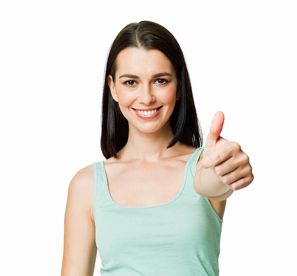istock Young Woman Giving a Thumbs Up - Isolated 184597645