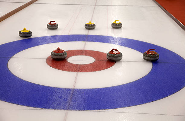 istock Curling stones on an indoor rink 184597812