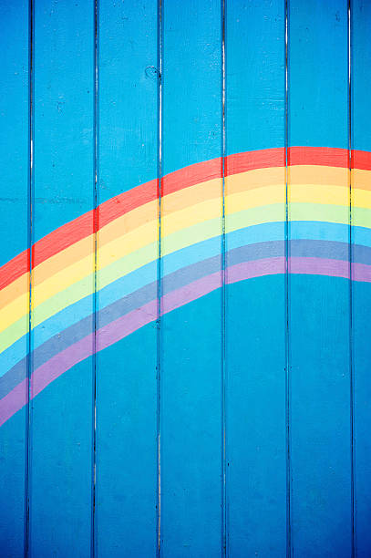 istock Hand Painted Rainbow Sky Blue Wood Background 184597935