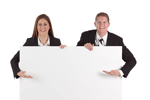 istock Business couple showing a placard 184598041