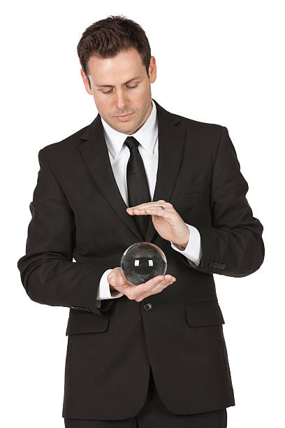 istock Businessman holding a crystal ball 184598552