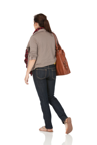 Woman carrying a leather baghttp://www.twodozendesign.info/i/1.png