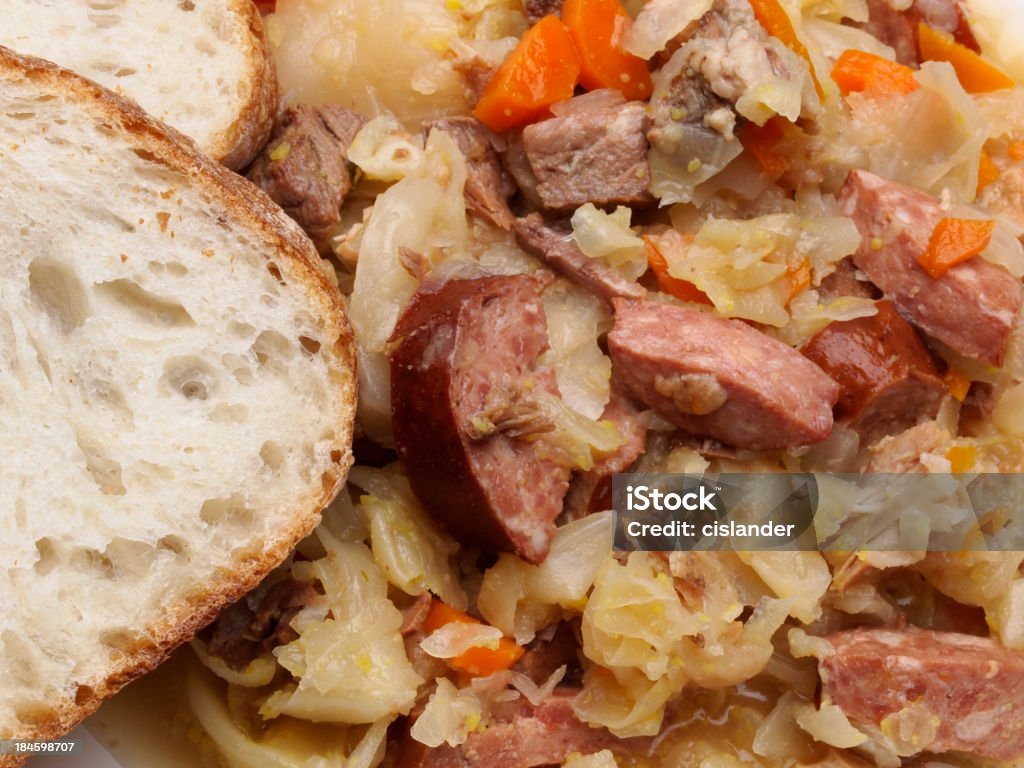 Bigos (Polish Hunter Stew) "The national dish of Poland. Bigos is a stew of cabbage, onions, carrots and various meats both fresh and smoked.Warm Hearth Bread" Stew Stock Photo