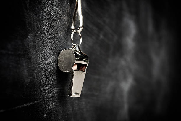 coach whistle hanging from board Whistle on a blackboard whistle stock pictures, royalty-free photos & images