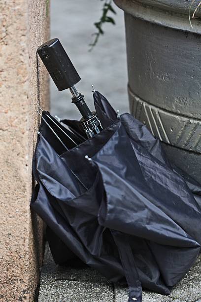 istock Broken Black Umbrella, Downtown Vancouver Sidewalk, British Columbia, Canada 184599201