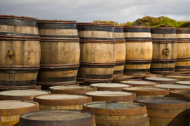 Wine barrels Whisky or wine barrels in distillery on Islay bowmore whisky stock pictures, royalty-free photos & images