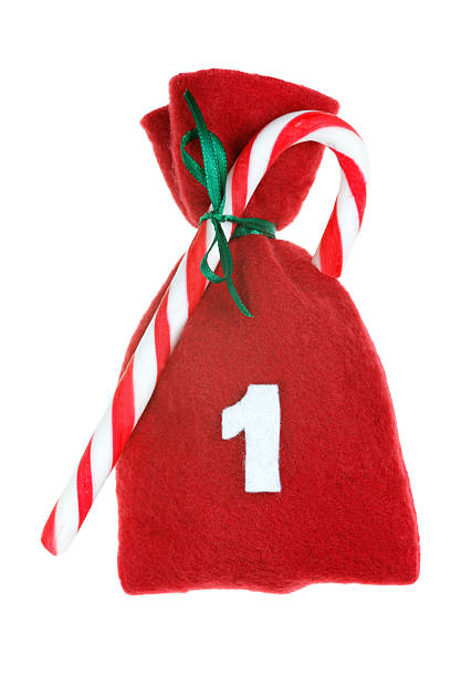 Santa Claus red bag with white gifts and red ribbon  on white background.