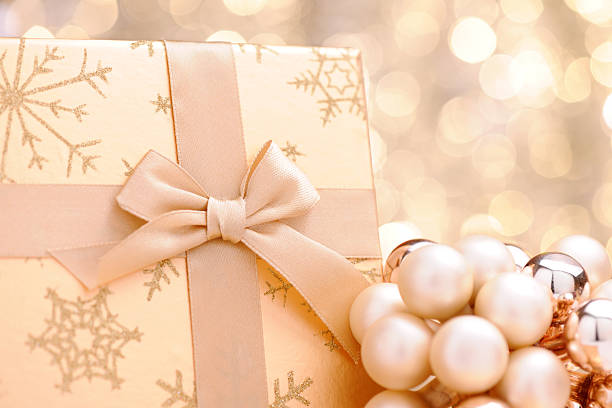 istock Golden christmas present with illuminated background 184599493