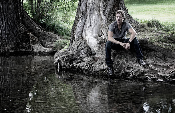 istock Man in Thought by the Water 184599858