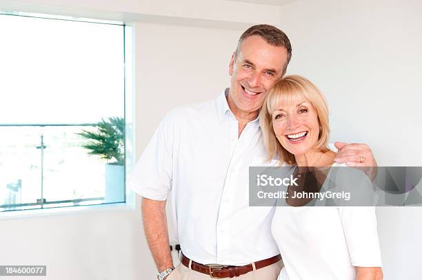 Happy Senior Couple Indoors Stock Photo - Download Image Now - 60-64 Years, 60-69 Years, Adult