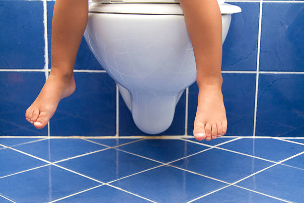 Child sitting on the toilet