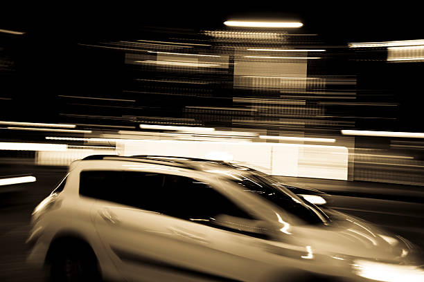 istock Paris traffic with panning motion at night 184600750