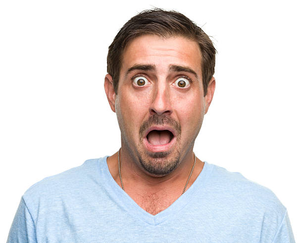 istock Shocked gasping young man wearing blue shirt 184600788