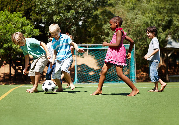 istock Children playing football 184600987
