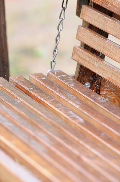 istock Rain drops on the wooden swing 184601048