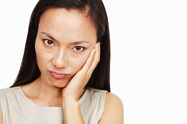 istock Unhappy Asian female 184601349