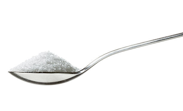 Sugar on teaspoon "sugar/salt on teaspoon, sideview isolated on white" teaspoon stock pictures, royalty-free photos & images