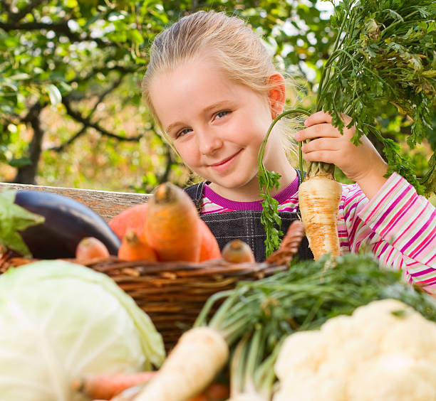 istock Girl holding vegetables 184601584