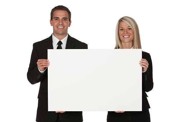 istock Business couple holding a placard 184602744