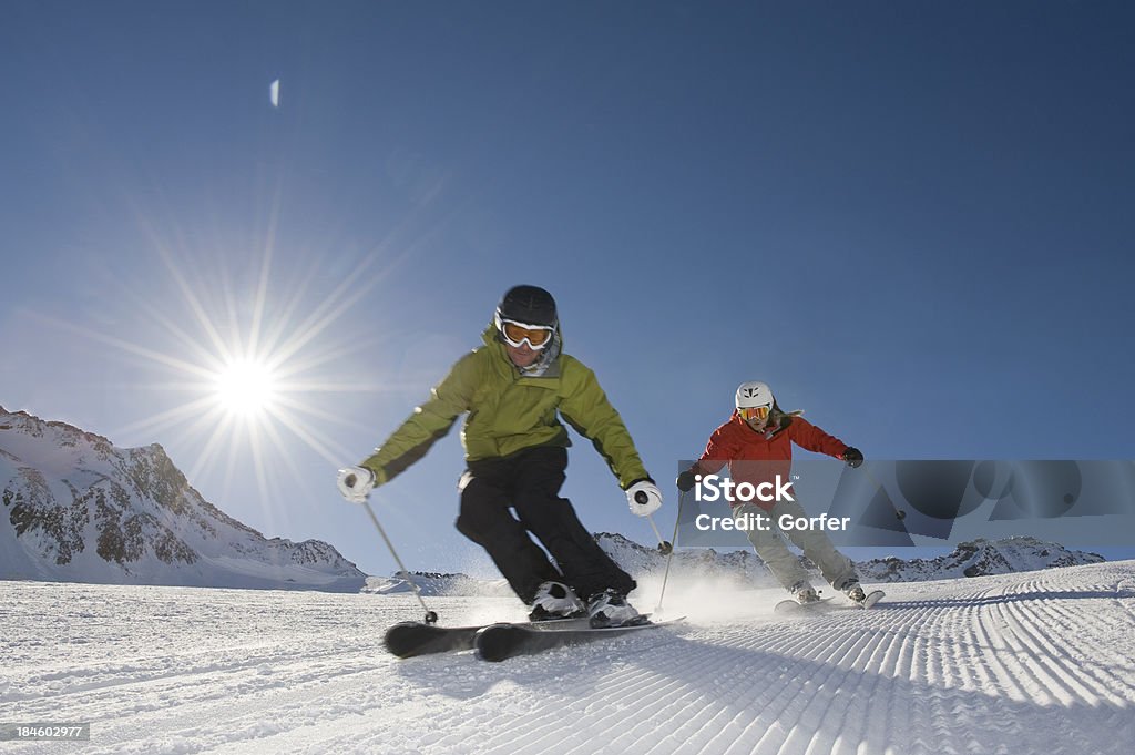 Skier in action with the sun behind Winter vacation and enjoy skiing in such a blazing suns tag Skiing Stock Photo