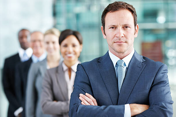 istock Dedicated male leader with team 184603023